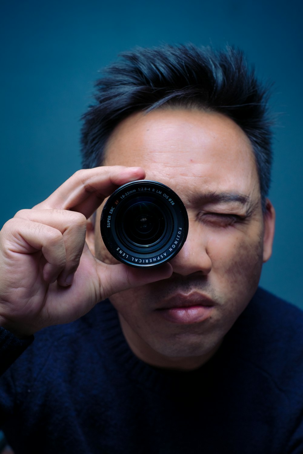 person holding zoom lens