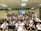 A group of satisfied students posing together after the course.