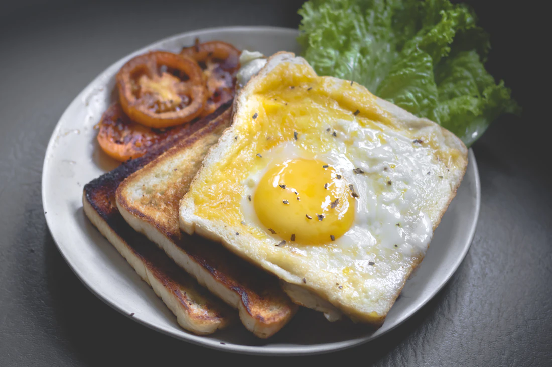 Breakfast plate with eggs, toast and potatoes