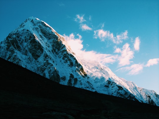 mountain with snow during daytime in Pumori Nepal