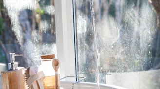 white ceramic sink beside window