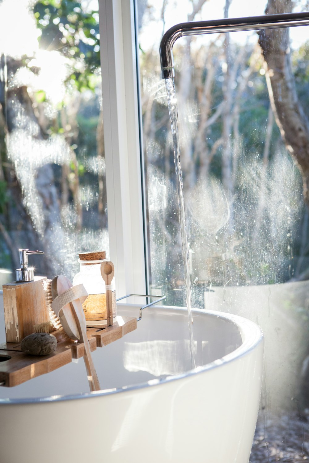 white ceramic sink beside window