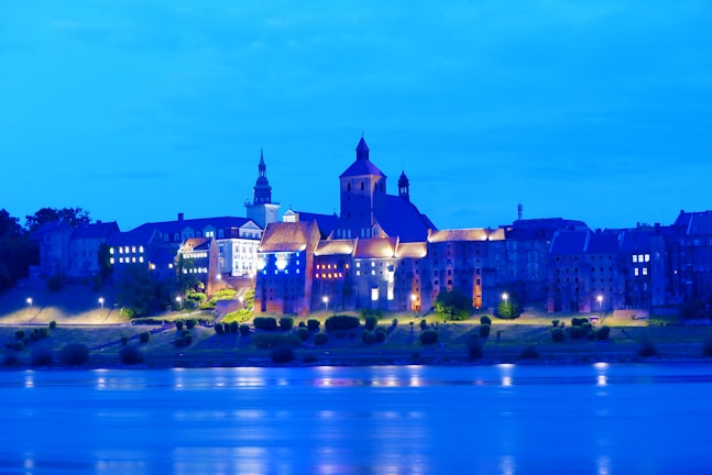 A serene cityscape view of central London at twilight, with iconic landmarks softly illuminated.