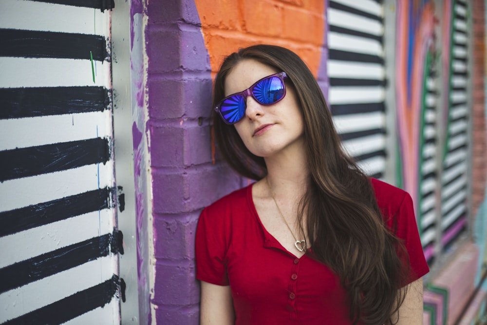 woman leaning on wall