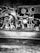 A collection of various keys and lock hardware is arranged on a dark surface. The word 'FAMILY' is spelled out using some of the keys. The image is in black and white, giving it a vintage and industrial feel.