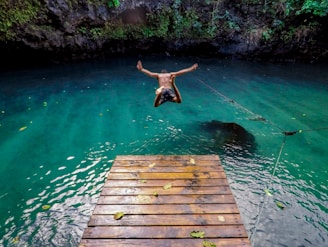 man diving in water