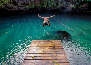 man diving in water