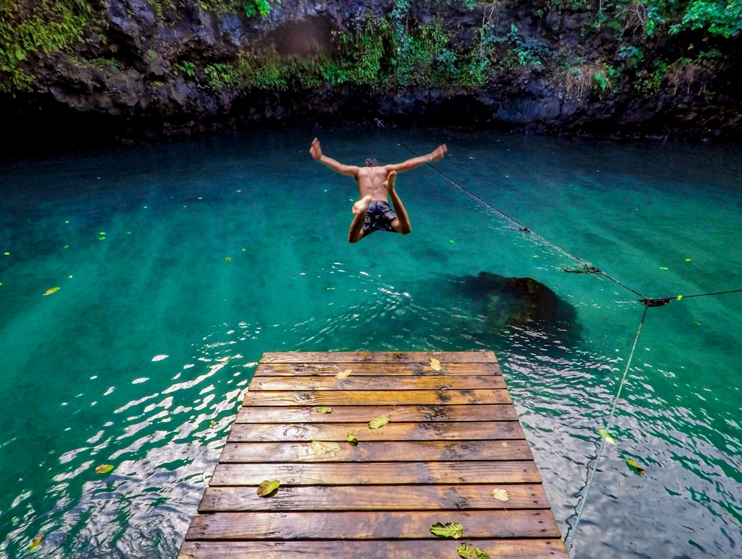 man diving in water