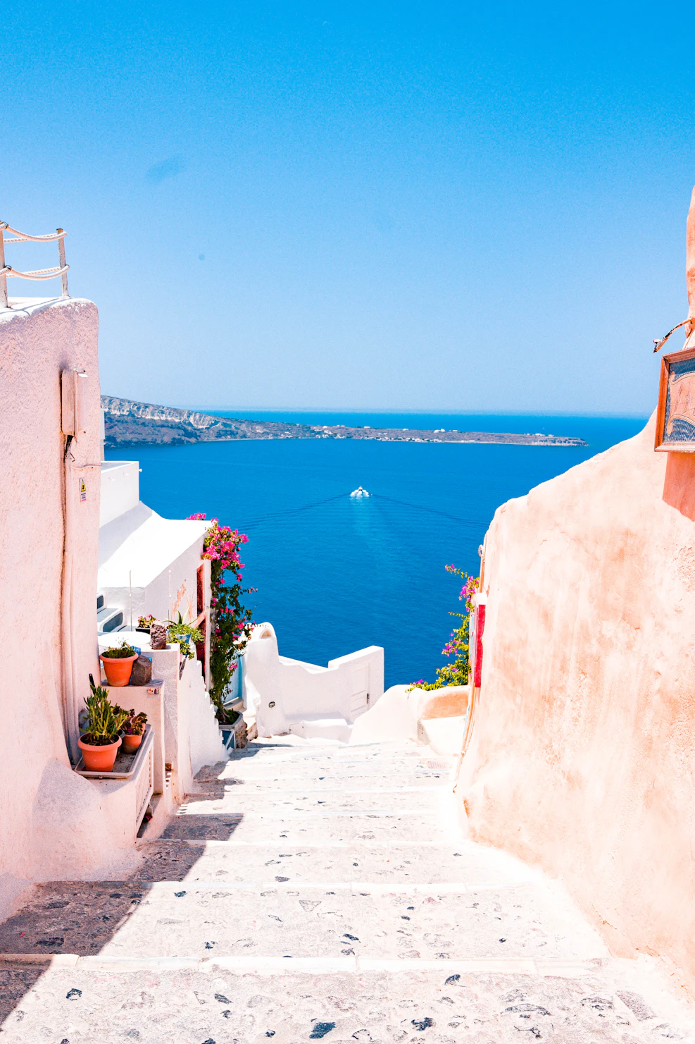 Santorini white buildings with blue domes and sea view