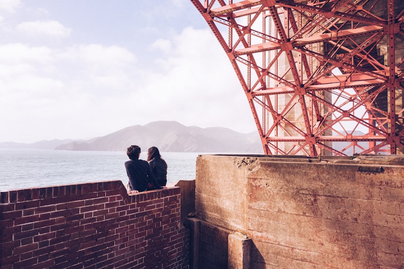 International couple in sunny alley