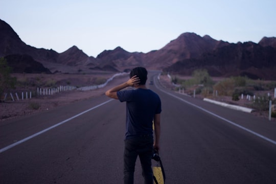 man standing on concrete road in Mexicali Mexico