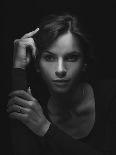 Black and white portrait of Solange Olavarría directing backstage with focused intensity