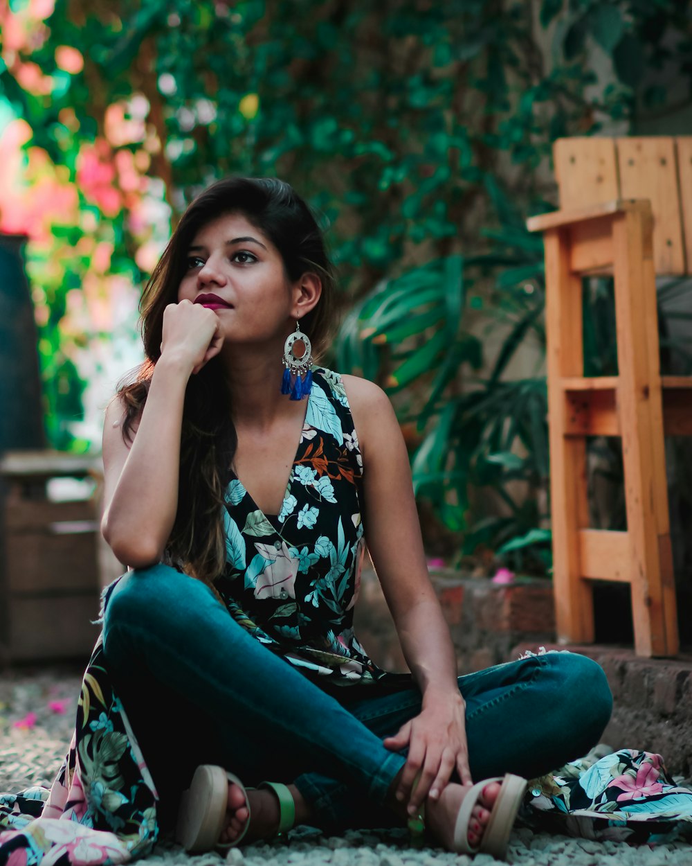 woman sitting on gravel