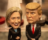 A happy family posing with their custom bobbleheads.