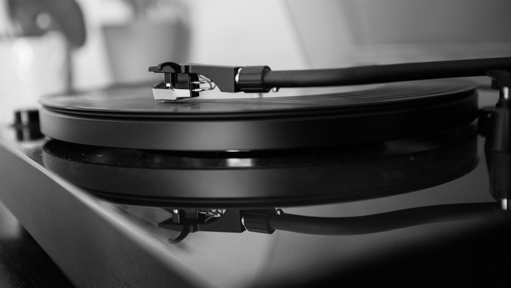 grayscale photo of vinyl player
