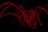 Abstract digital particles flowing over a dark background with red glowing highlights.