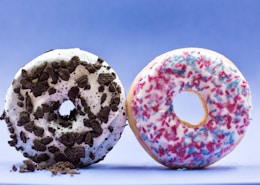 shallow focus photo of two donuts