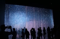 people in dark room standing