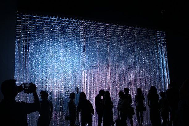 people in dark room standing