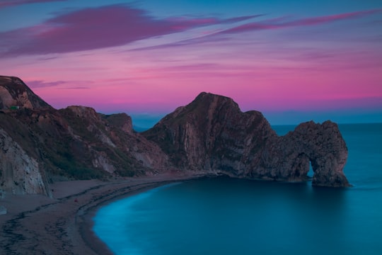 birds eye view photography of island and body of water in Durdle Door United Kingdom