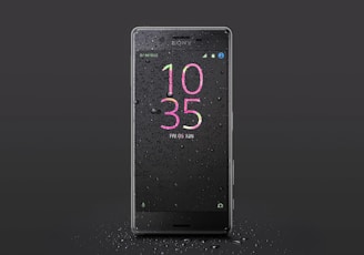 black Sony Android smartphone with water drops