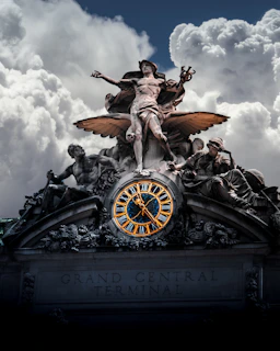 selective color photo of Grand Central Terminal statue