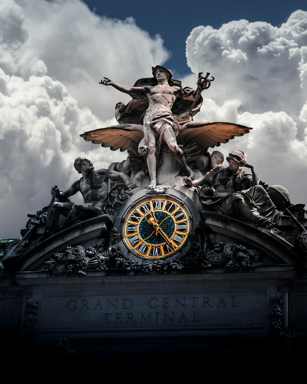 selective color photo of Grand Central Terminal statue