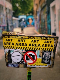 a street sign with a lot of stickers on it