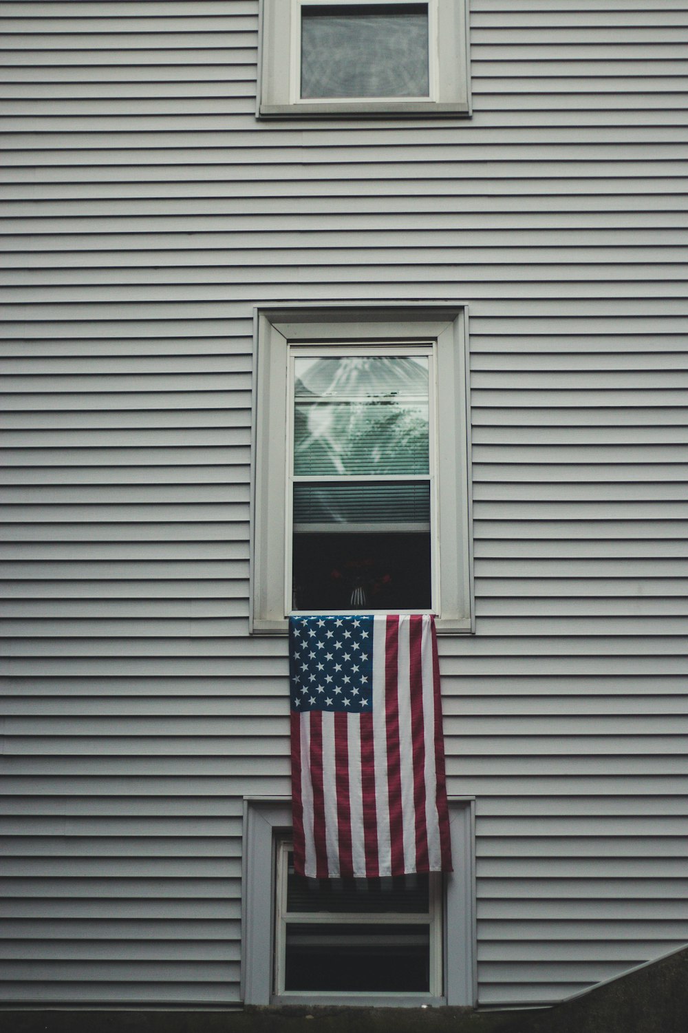 USA flag on window pane