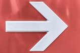 white arrow sign of wall