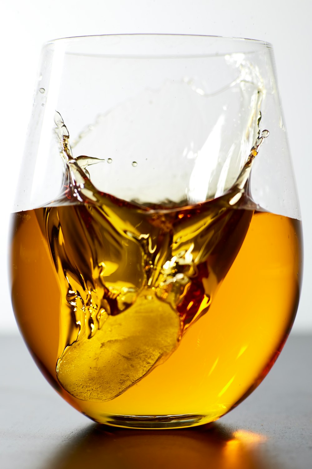 liquor filled clear stemless glass