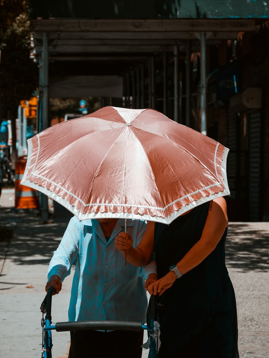 woman holding umbrella while walking