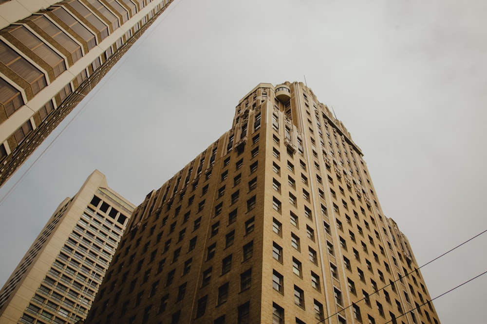 low angle view photogrpahy of brown building