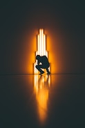 silhouette of man crouching