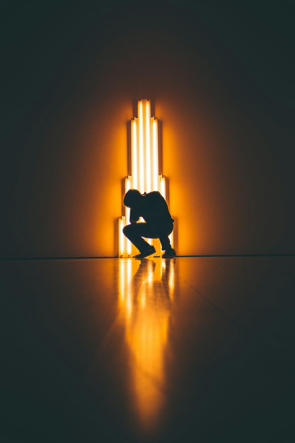 silhouette of man crouching