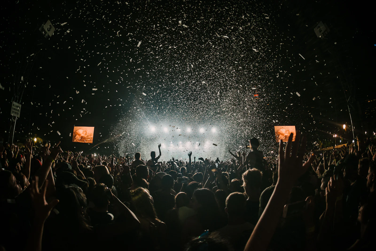 Confetti falling over a crowded dance floor at a formal evening event