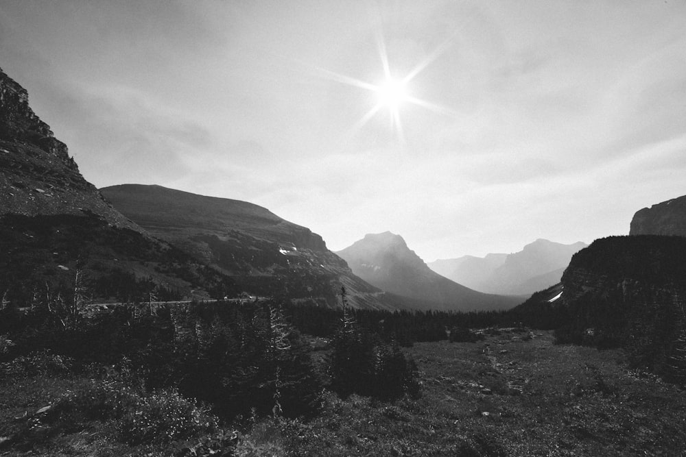 a black and white photo of a mountain range