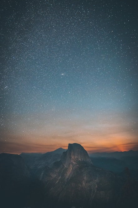 mountains under starry sky