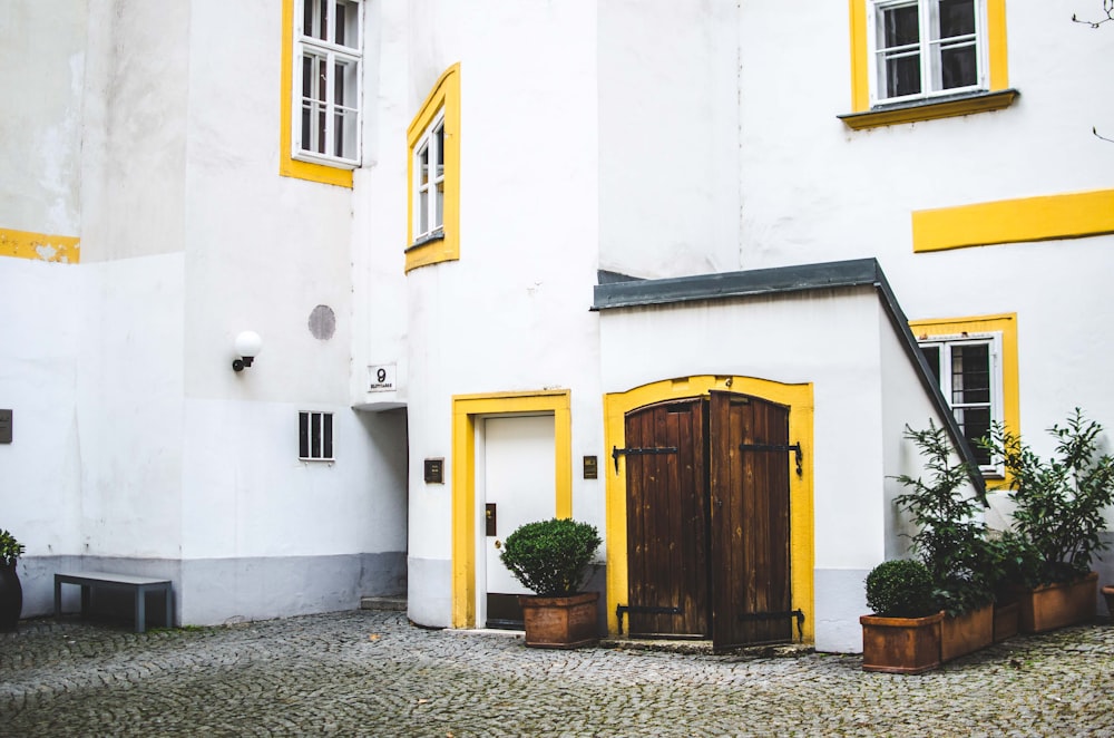 photo of white and yellow concrete building