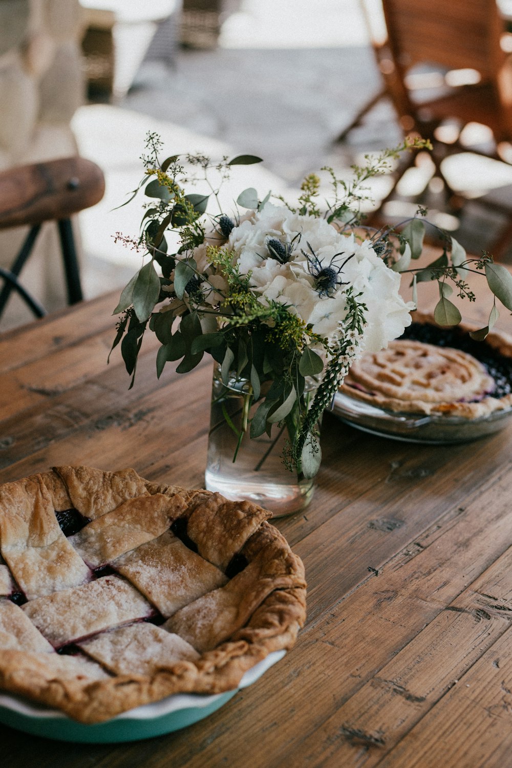 focus photography of flowers between pies