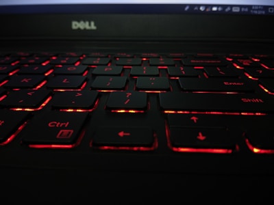 A close-up of a Dell notebook keyboard with vibrant backlighting.
