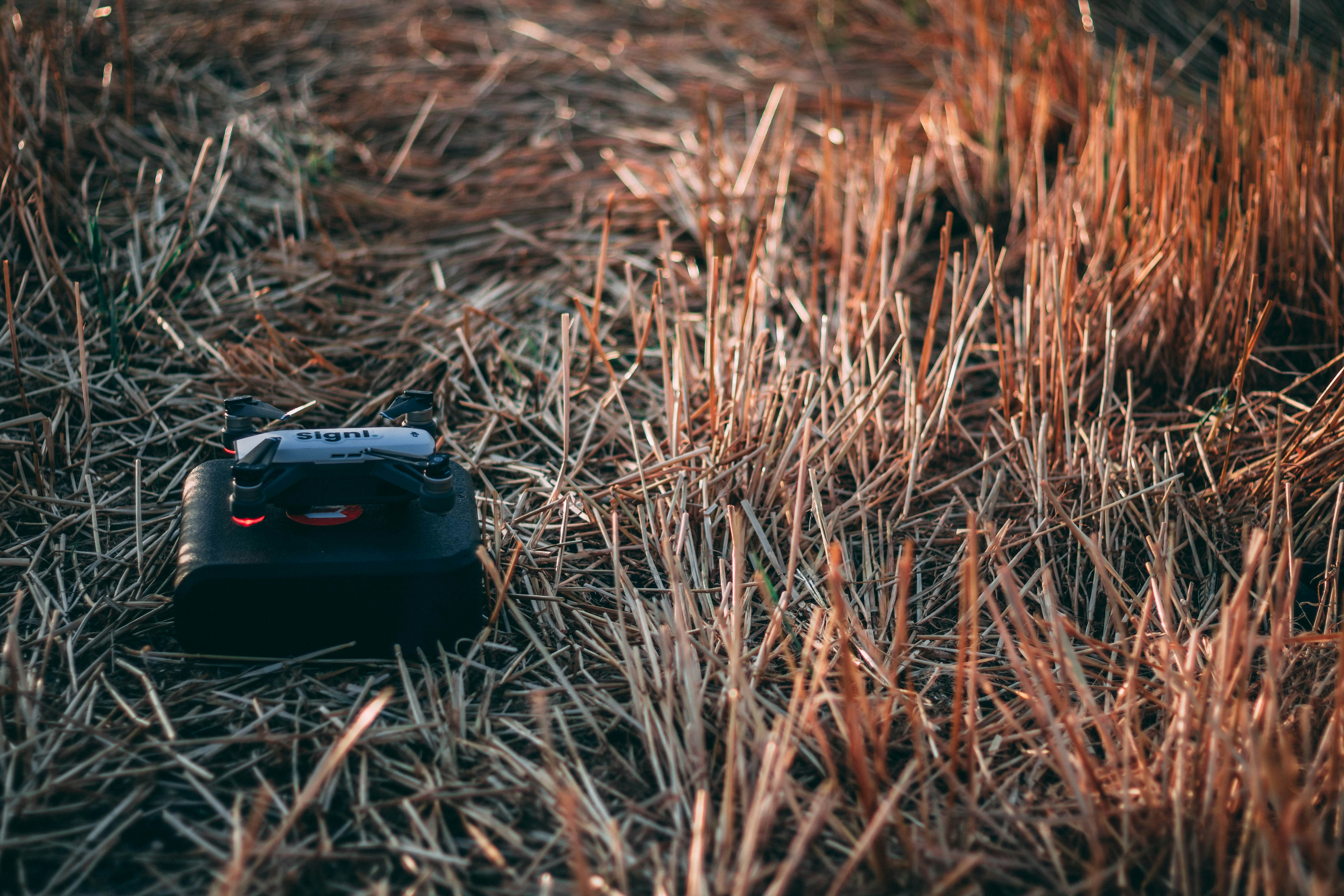 black electronic device on grass