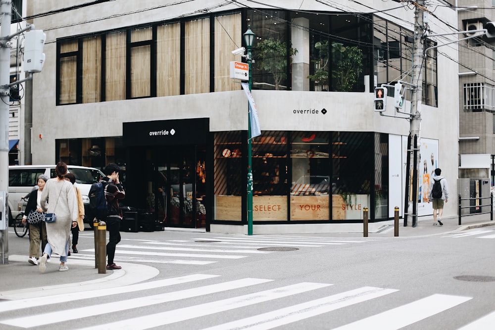 person standing on the corner of the road