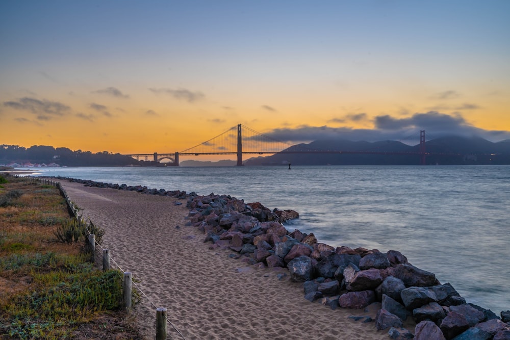 a view of the golden gate bridge from the beach