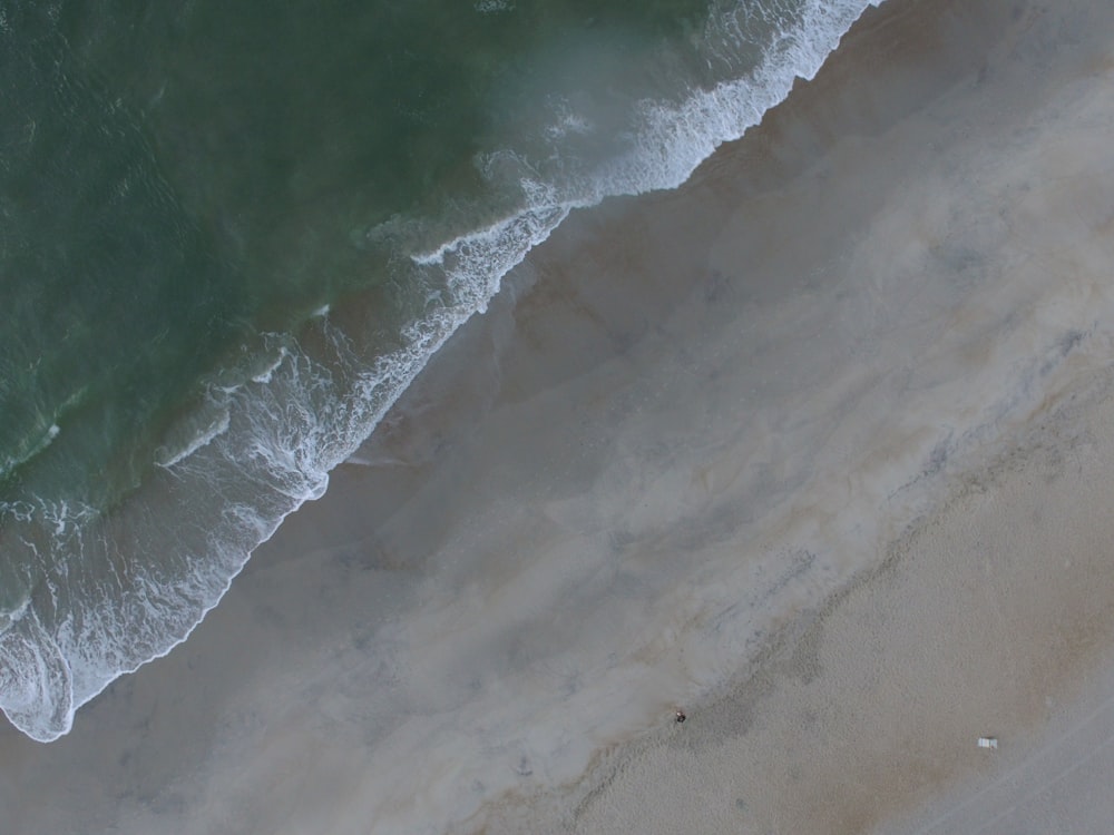 a bird's eye view of a beach and ocean