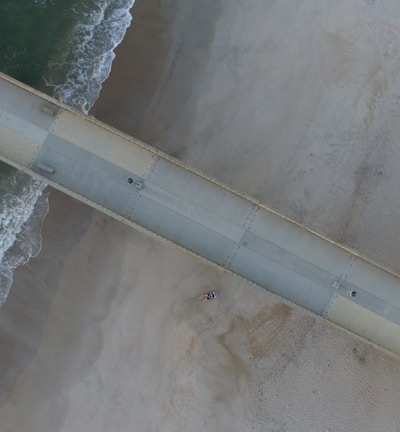 vehicles on bridge at sea