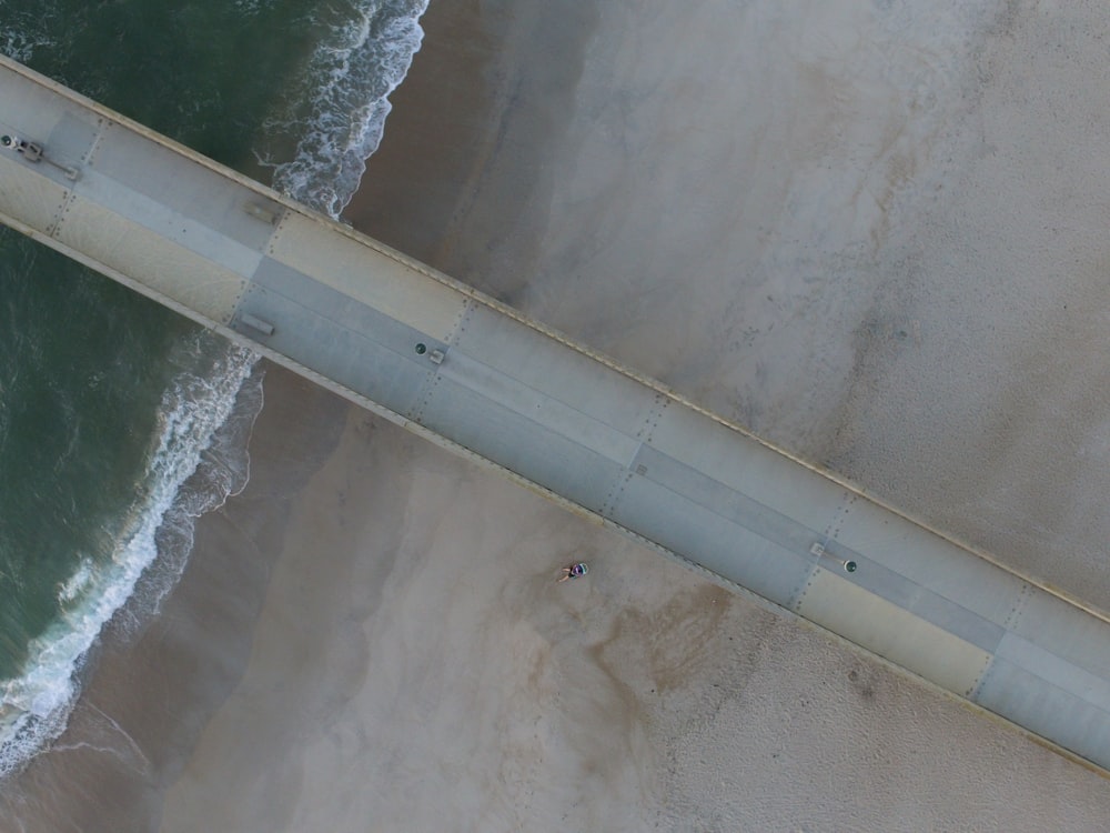 vehicles on bridge at sea