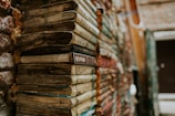 a stack of books sitting next to a building