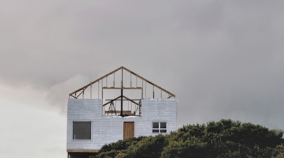 Photo of a wooden frame structure of a new home under construction in the Puget Sound area.