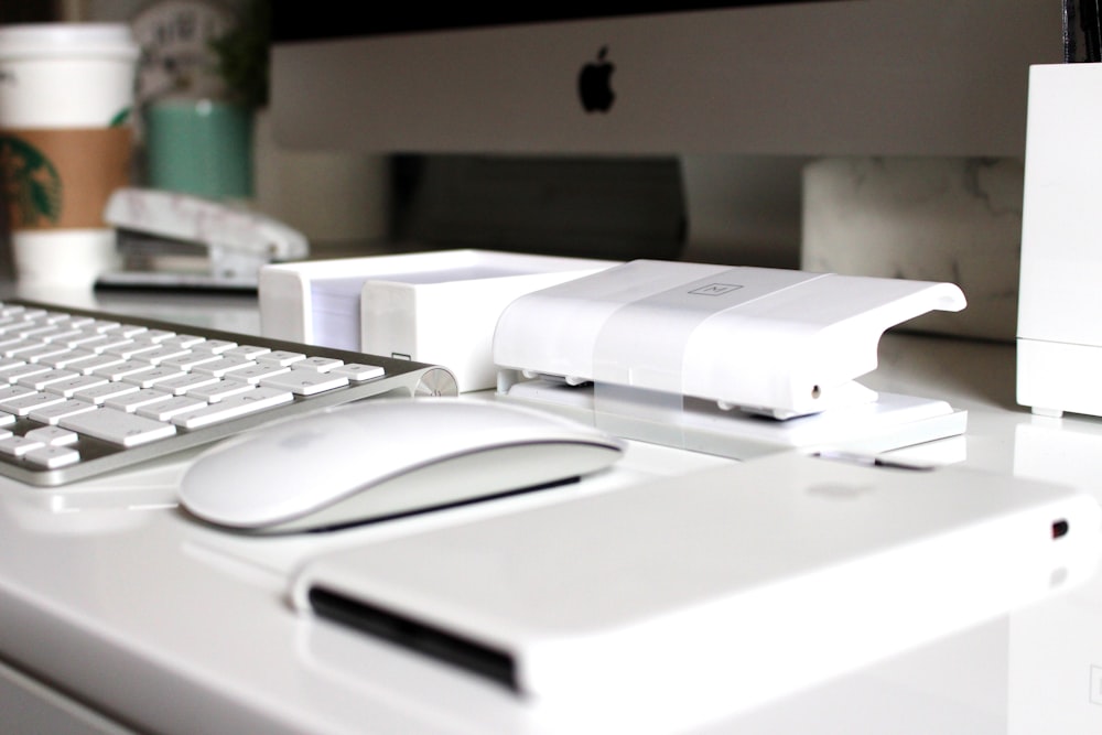 Apple Magic Mouse on white table